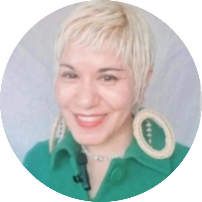 Beautiful Indian woman, with blonde short hair, beautiful smile, wearing a lovely green top.